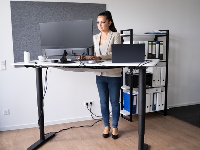 Custom-made height-adjustable desks enable you to sit and stand